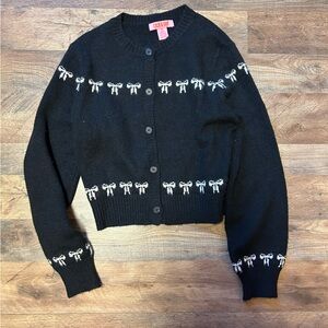 coco & shay black button up cardigan with cute white bow detailing